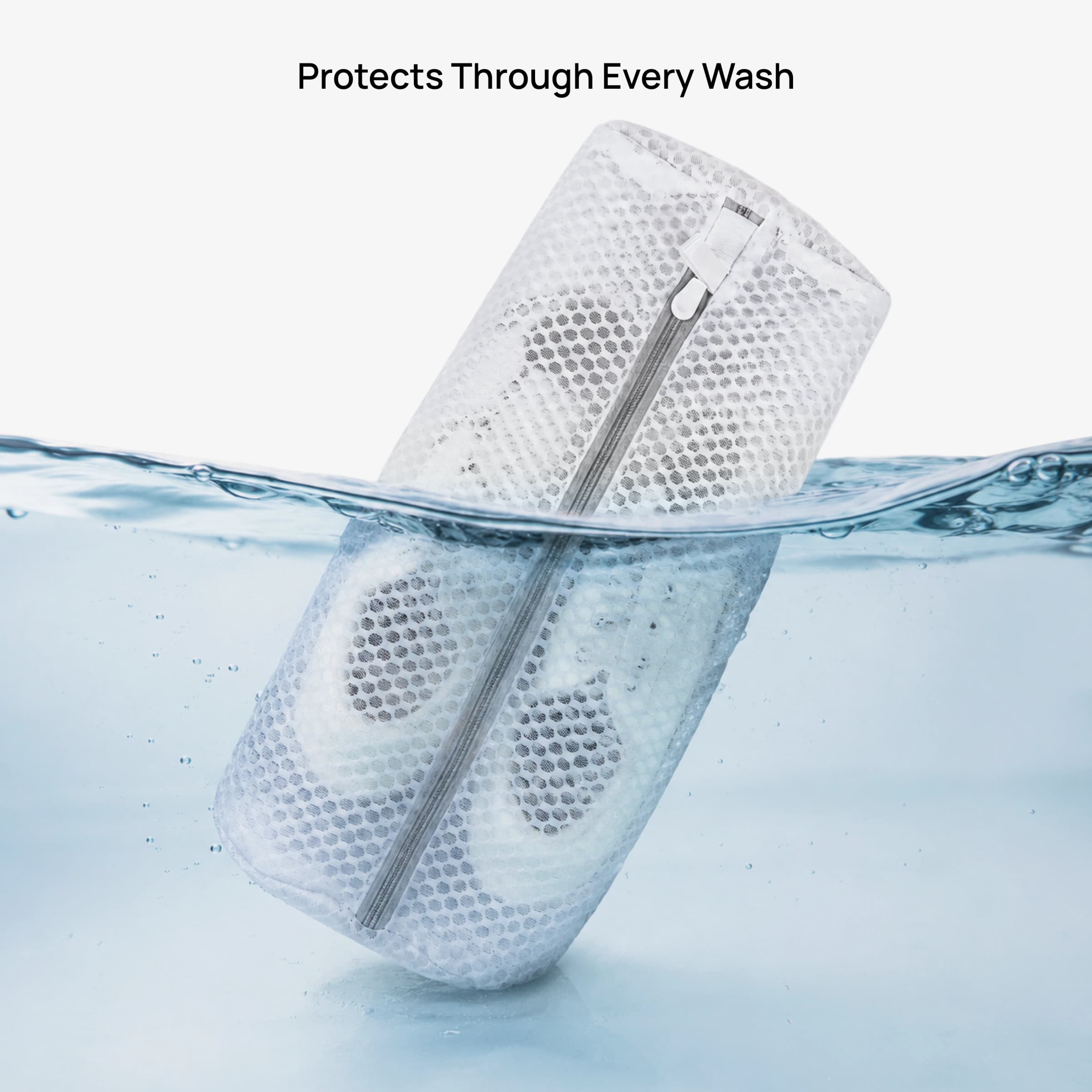 Protects Through Every Wash — cylindrical bag submerged with shoes inside