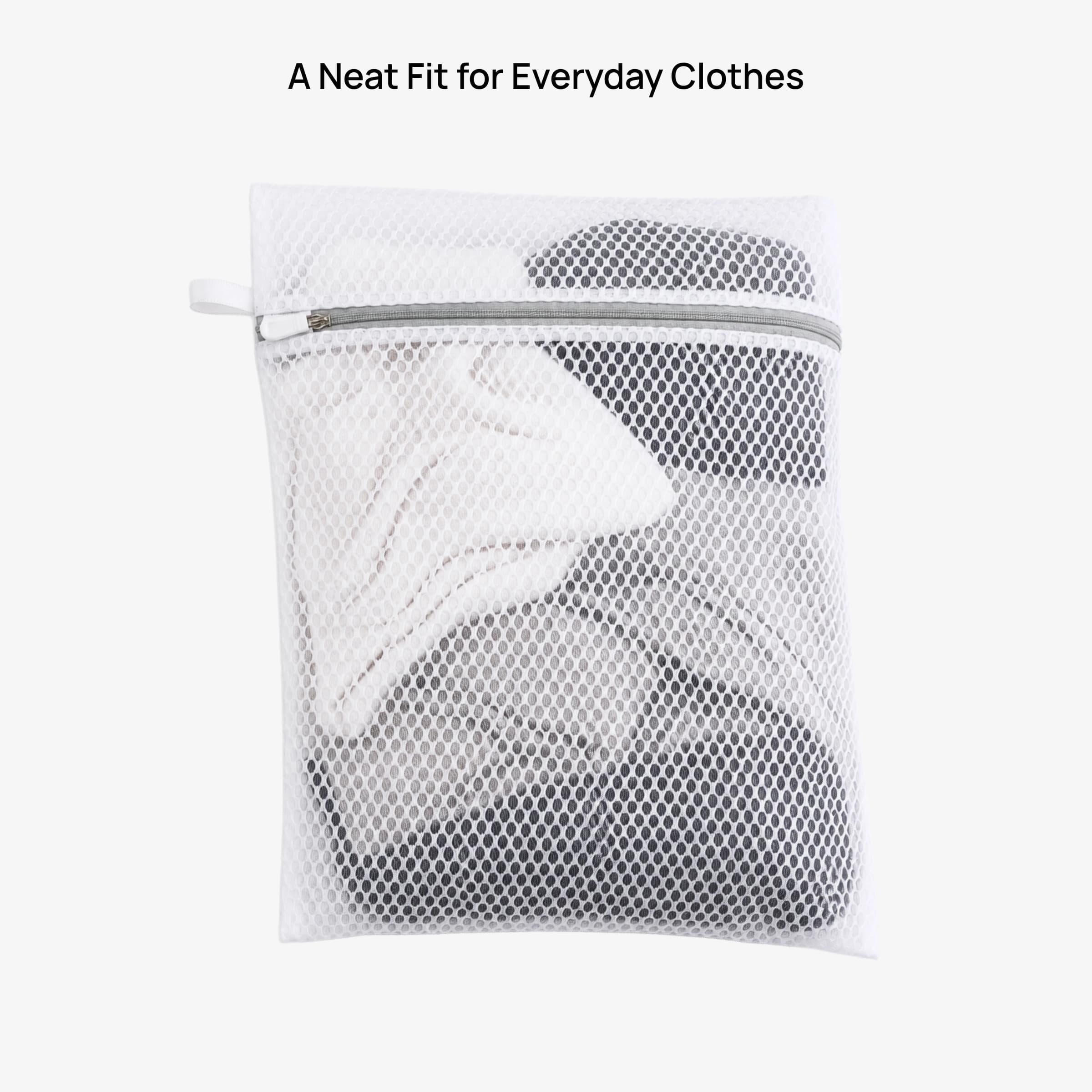 A Neat Fit for Everyday Clothes — mesh bag filled with folded garments