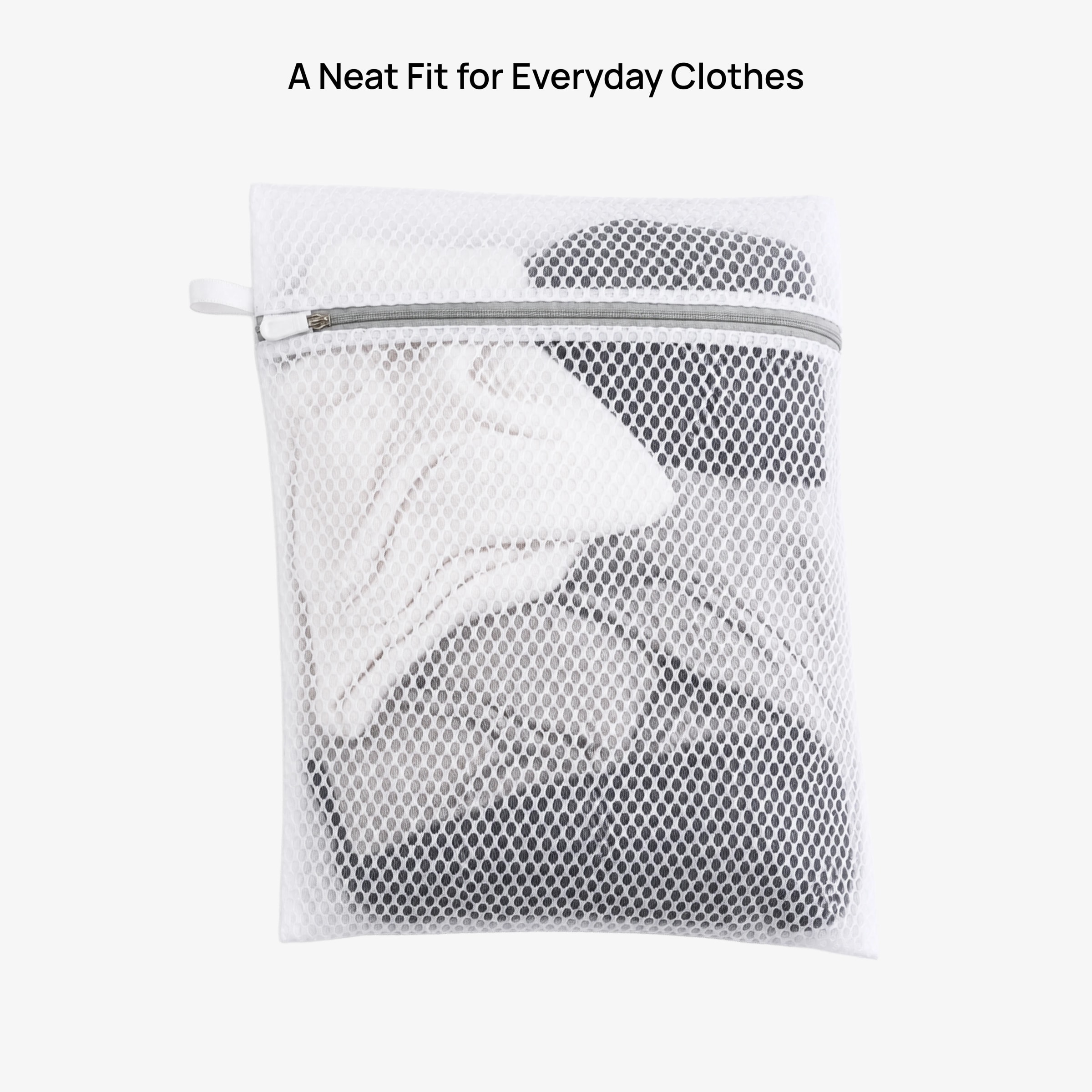 A Neat Fit for Everyday Clothes — mesh bag filled with folded garments